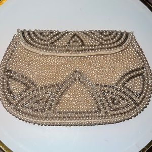 Small pearl wallet by the FBI by cream colored pearls with light tan beading